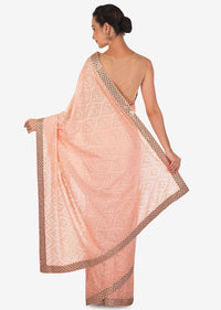Light pink saree in georgette with thread and kundan work only on Kalki