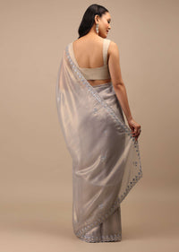 Lilac Grey Glass Tissue Saree In Mirror Abla Embroidery Buttis, Border Has Zari Embroidery Detailing