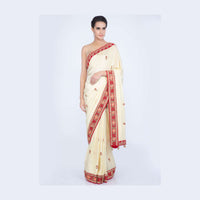 Lime yellow silk saree with floral embroidered butti and border only on Kalki