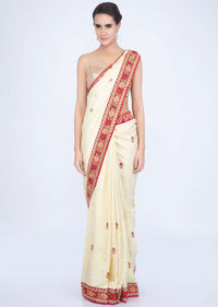 Lime yellow silk saree with floral embroidered butti and border only on Kalki