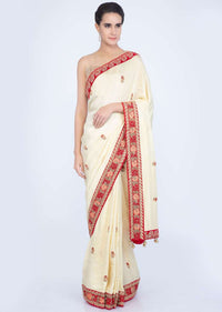 Lime yellow silk saree with floral embroidered butti and border only on Kalki