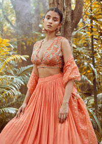 Fusion Coral Skirt In Crepe With Hand Embroidered Raw Silk Choli With Plunging Neckline