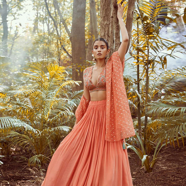 Fusion Coral Skirt In Crepe With Hand Embroidered Raw Silk Choli With Plunging Neckline