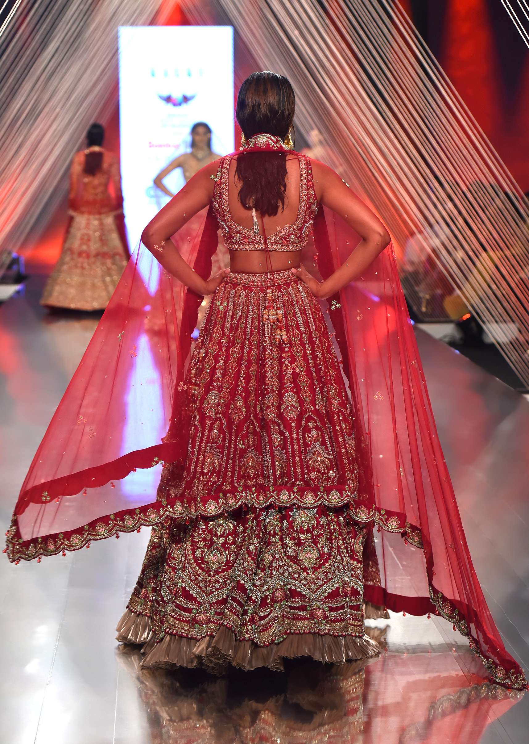 Red Lehenga And A Crop Top In Royal Heritage Embroidery, Bustier Comes In Sleeveless With Back Hooks Closure