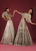 Oyster Lehenga With An Organza Cape Top And Cut Dana Handwork On The Lehenga