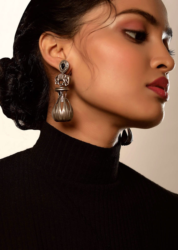 Oxidised Earrings With Carved Elephant Motif And Studded With A Blue Semi Precious Stone