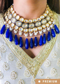 Gold Plated Necklace Adorned With Kundan, Pearls And Dangling Blue Beads By Prerto