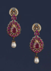 Magenta Crystal Studded Drop Shaped Danglers With Stones And Dangling Pearl Online - Kalki Fashion