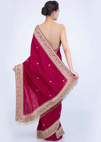 Magenta jute cotton saree with embroidered butti and border only on Kalki