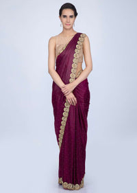 Magenta satin saree with golden scallop embroidered pallo only on Kalki