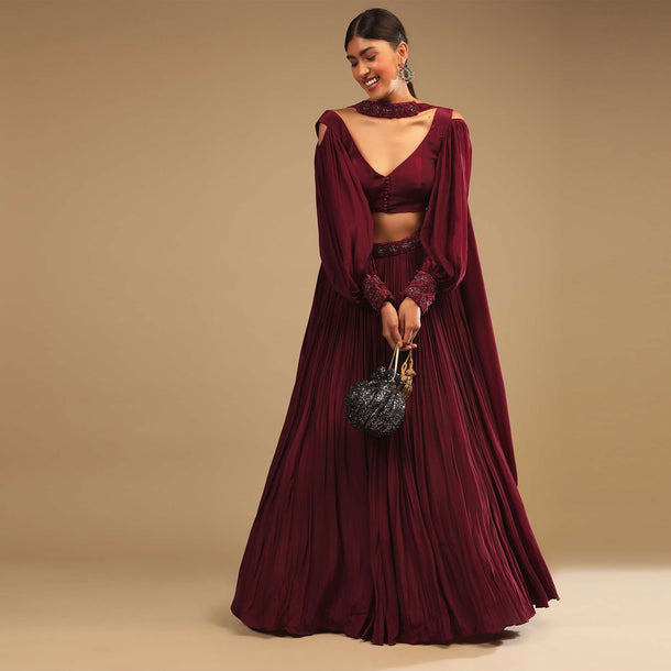 Maroon Lehenga In Crepe With Embroidery Detailing On The Waist And Bishop Sleeved Crop Top