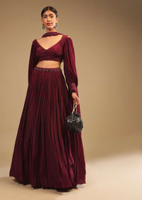 Maroon Lehenga In Crepe With Embroidery Detailing On The Waist And Bishop Sleeved Crop Top