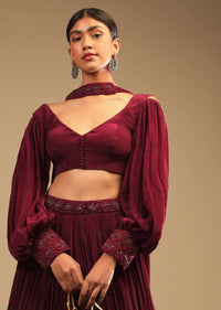 Maroon Lehenga In Crepe With Embroidery Detailing On The Waist And Bishop Sleeved Crop Top