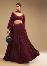 Maroon Lehenga In Crepe With Embroidery Detailing On The Waist And Bishop Sleeved Crop Top