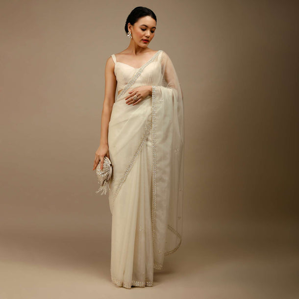 Marshmallow White Saree In Organza With Moti Beads And Stone Embroidered Round Motifs On The Border And Butti Design