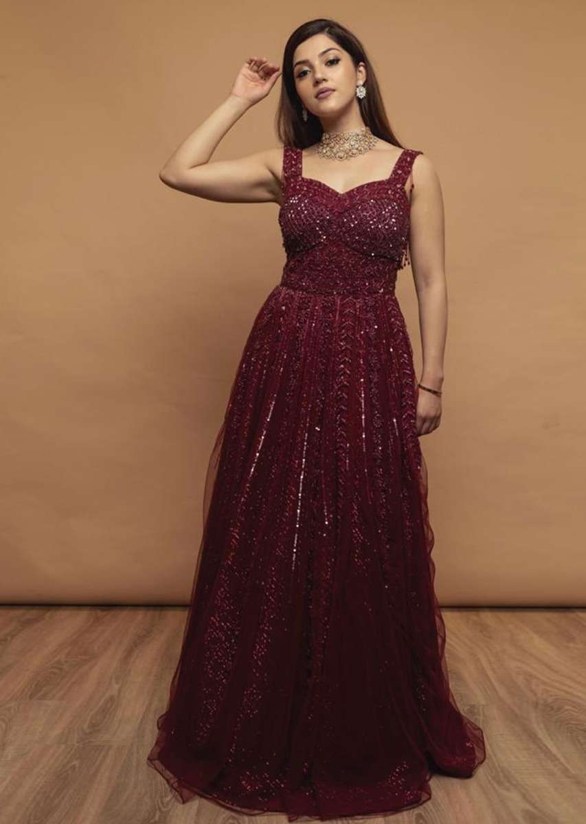 Mehreen In Kalki Burgundy Gown In Embellished Net With Fancy Cut Out Back