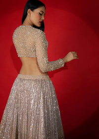 Melon Peach Ombre Lehenga Embellished In Sequins With Moti Embroidered Crop Top With Illusion Neckline And Full Sleeves