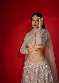 Melon Peach Ombre Lehenga Embellished In Sequins With Moti Embroidered Crop Top With Illusion Neckline And Full Sleeves