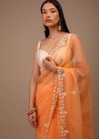 Melon Orange Saree In Organza With Hand Embroidered Moti And Sequin Work On The Border And Butti Design