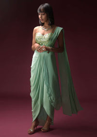 Mint Blue Dhoti Skirt With Attached Saree Drape And Ruffled Crop Top Adorned With Flower Shaped Mirror Work Online - Kalki Fashion