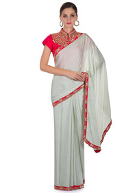 Mint Blue Satin Georgette Saree with Stitched Orange Raw Silk Blouse Featuring Zari Work only on Kalki