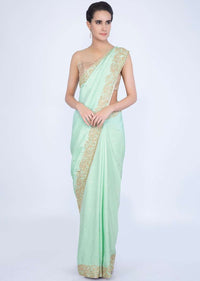 Mint green crepe silk saree with butti and border only on Kalki