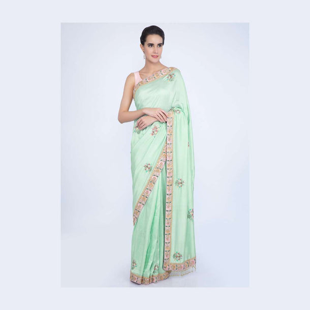 Mint green dupion silk blouse with multi color embroidery and butti only on Kalki