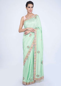 Mint green dupion silk blouse with multi color embroidery and butti only on Kalki