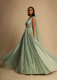 Mint Green Gown In Sequins Embellished Net With Ruching In The Front, Sheer Sides And Net Cape On Each Shoulder Online - Kalki Fashion