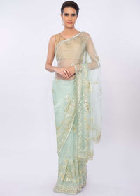 Mint green organza saree in floral embroidery and butti only on kalki