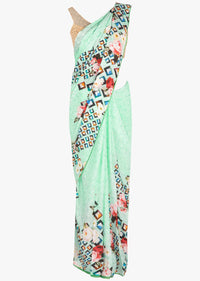 Mint green satin saree in geometric and floral motif only on Kalki