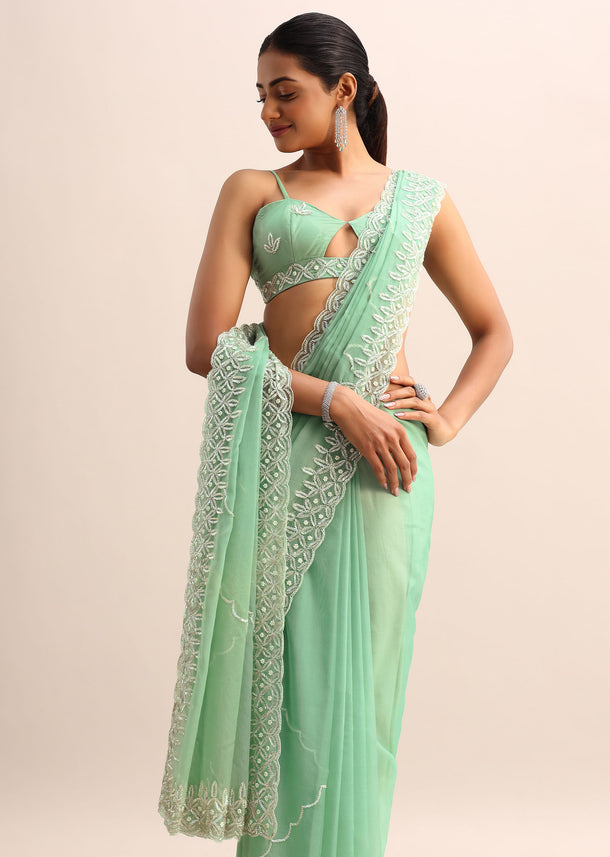 Mint Blue Organza Saree With Cutdana Embroidery And Scallop Border With Unstitched Blouse