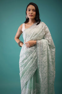 Mint green organza saree with Lucknowi threadwork