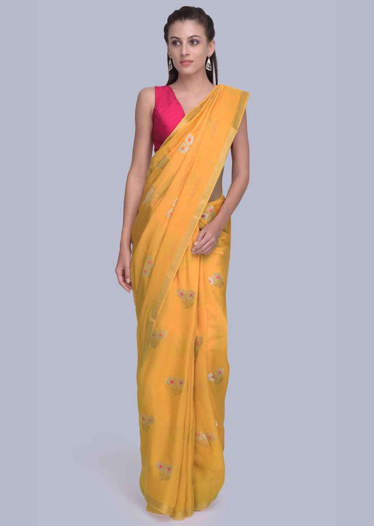 Mustard dola silk saree with weaved butti and tasseled pallo only on Kalki