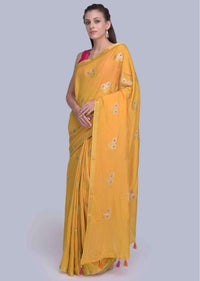 Mustard dola silk saree with weaved butti and tasseled pallo only on Kalki