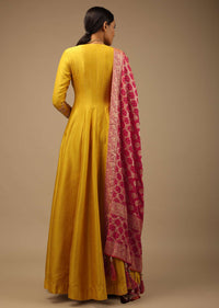 Mustard Angrakha Suit In Raw Silk With Hand Embroidery And A Contrasting Brocade Dupatta Enhanced With Bandhani