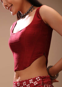 Maroon Corset Blouse In Raw Silk With Scooped Neckline And Tapered High Low Hem