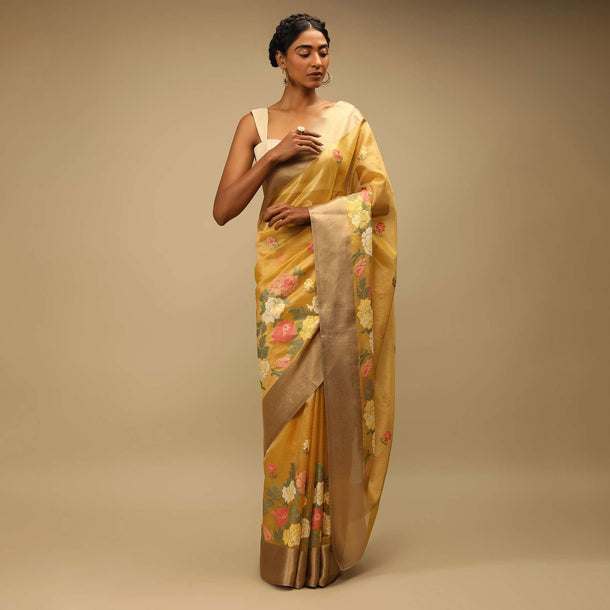 Mustard Saree In Zari Kota Silk With Multi Colored Resham Embroidered Flowers On The Border