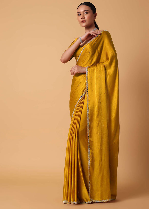 Mustard Satin Chinnon Saree With Mirror Detail Border And Unstitched Blouse Piece