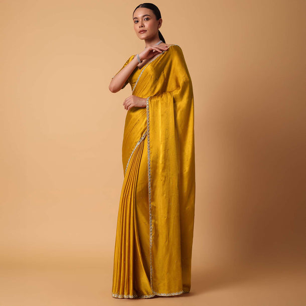 Mustard Satin Chinnon Saree With Mirror Detail Border And Unstitched Blouse Piece