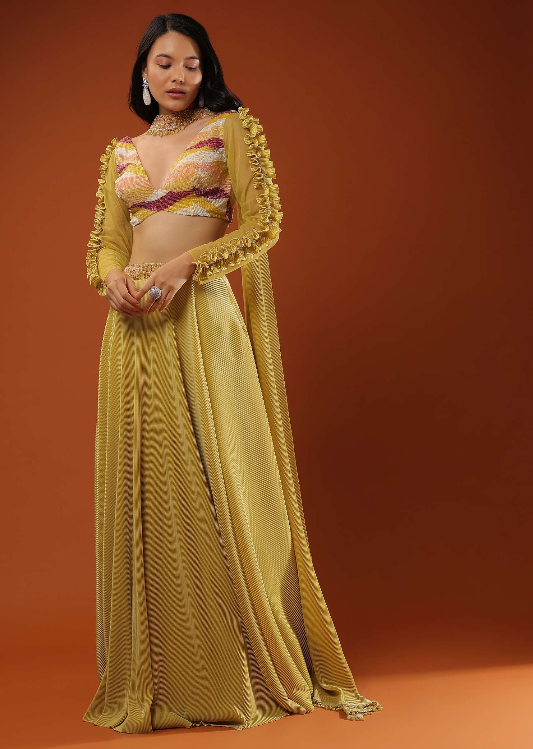 Mustard Yellow Lehenga And A Crop Top With Frills On The Top Of The Sleeves, Crafted In Crepe With Moti Embroidery