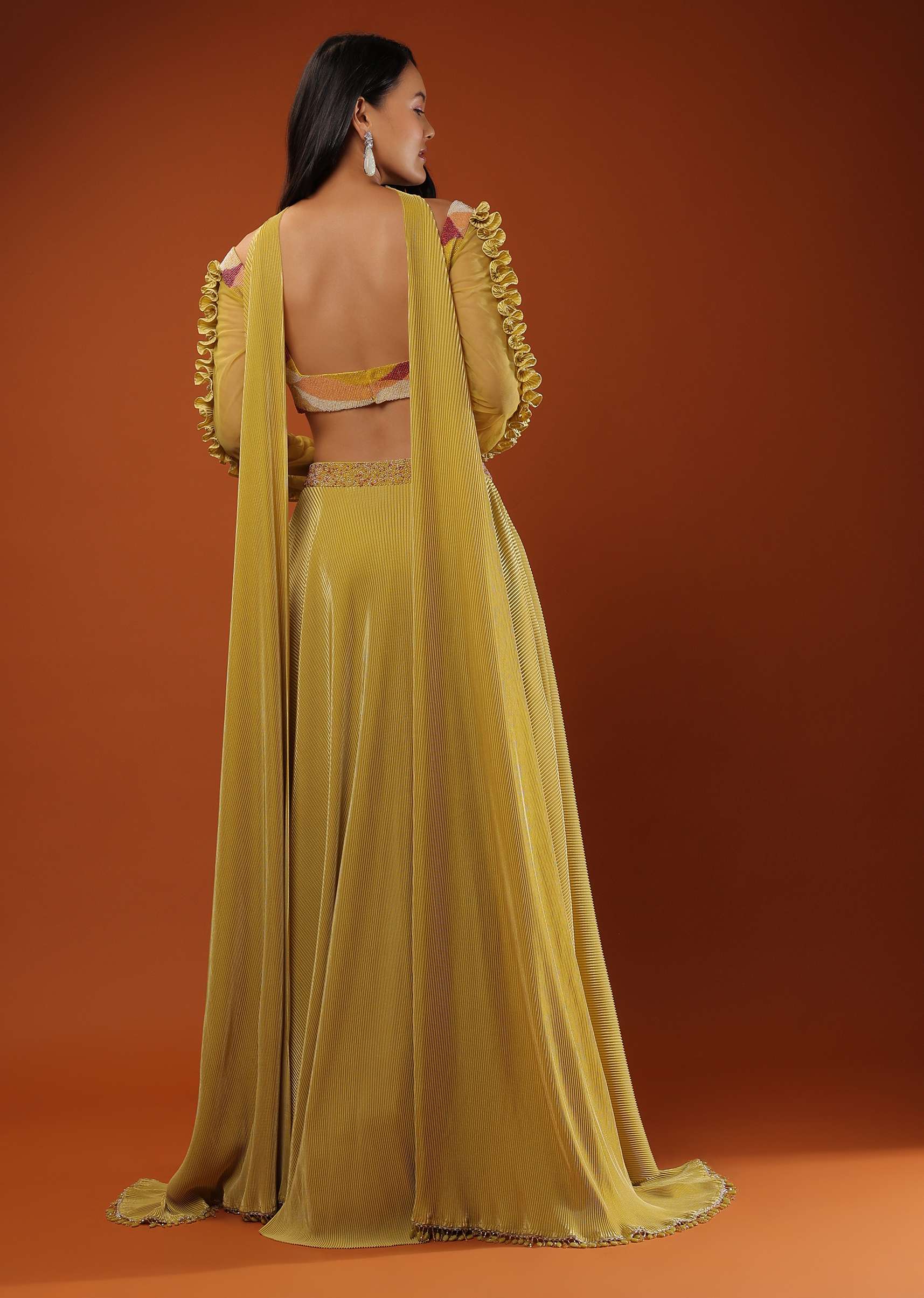 Mustard Yellow Lehenga And A Crop Top With Frills On The Top Of The Sleeves, Crafted In Crepe With Moti Embroidery