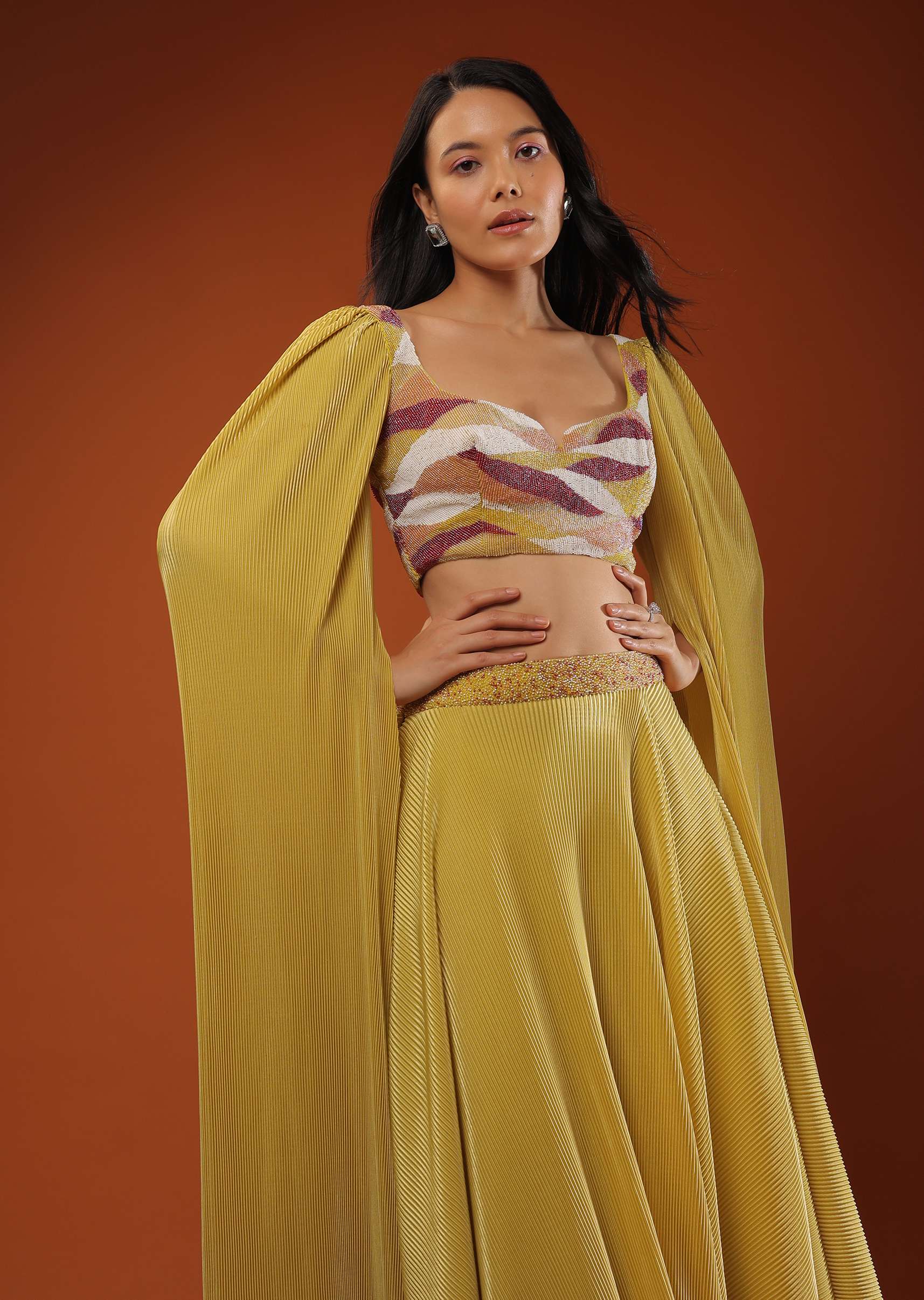 Mustard Yellow Lehenga And Crop Top In Long Cape Sleeves, Crafted In Crush With A Side Zip Closure