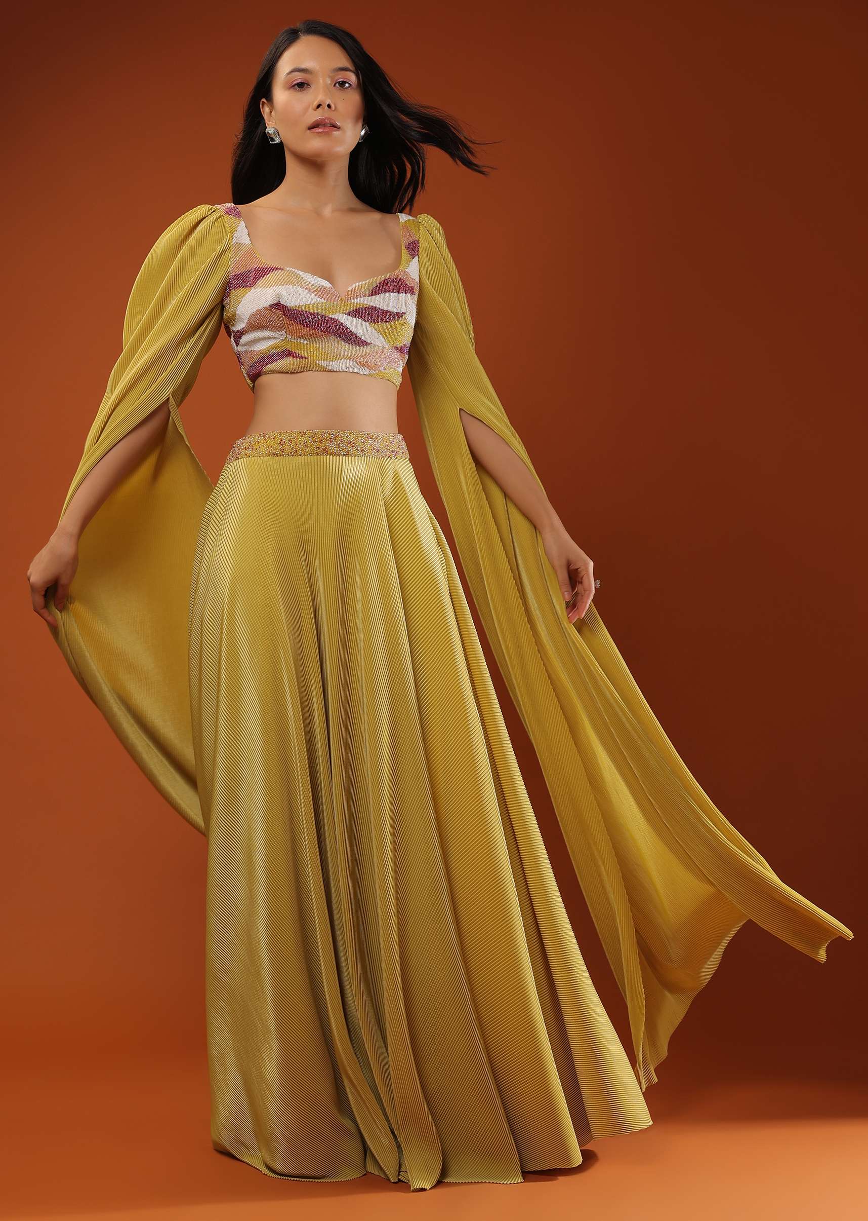 Mustard Yellow Lehenga And Crop Top In Long Cape Sleeves, Crafted In Crush With A Side Zip Closure