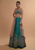 Ocean Green Lehenga Choli In Raw Silk With Resham Embroidered Spring Blooms And Scallop Hem