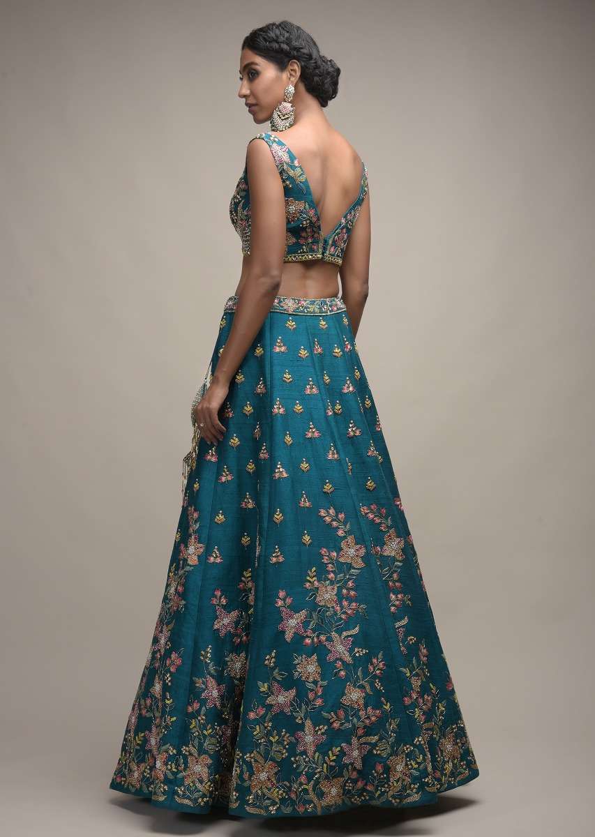 Ocean Green Lehenga Choli In Raw Silk With Colorful Resham Embroidered Spring Blossoms