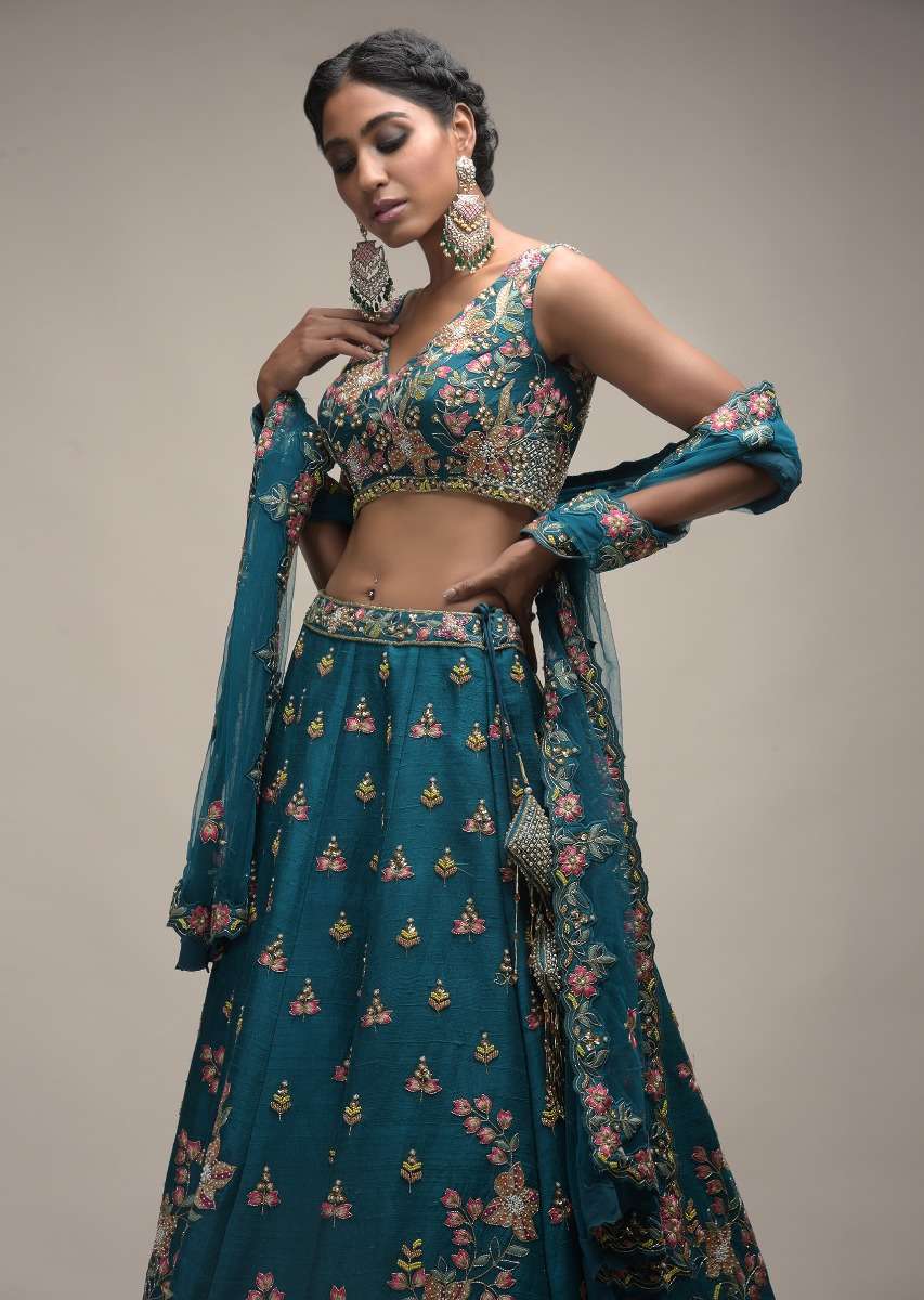 Ocean Green Lehenga Choli In Raw Silk With Colorful Resham Embroidered Spring Blossoms