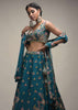 Ocean Green Lehenga Choli In Raw Silk With Colorful Resham Embroidered Spring Blossoms