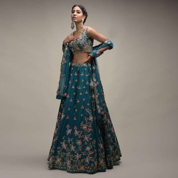 Ocean Green Lehenga Choli In Raw Silk With Colorful Resham Embroidered Spring Blossoms