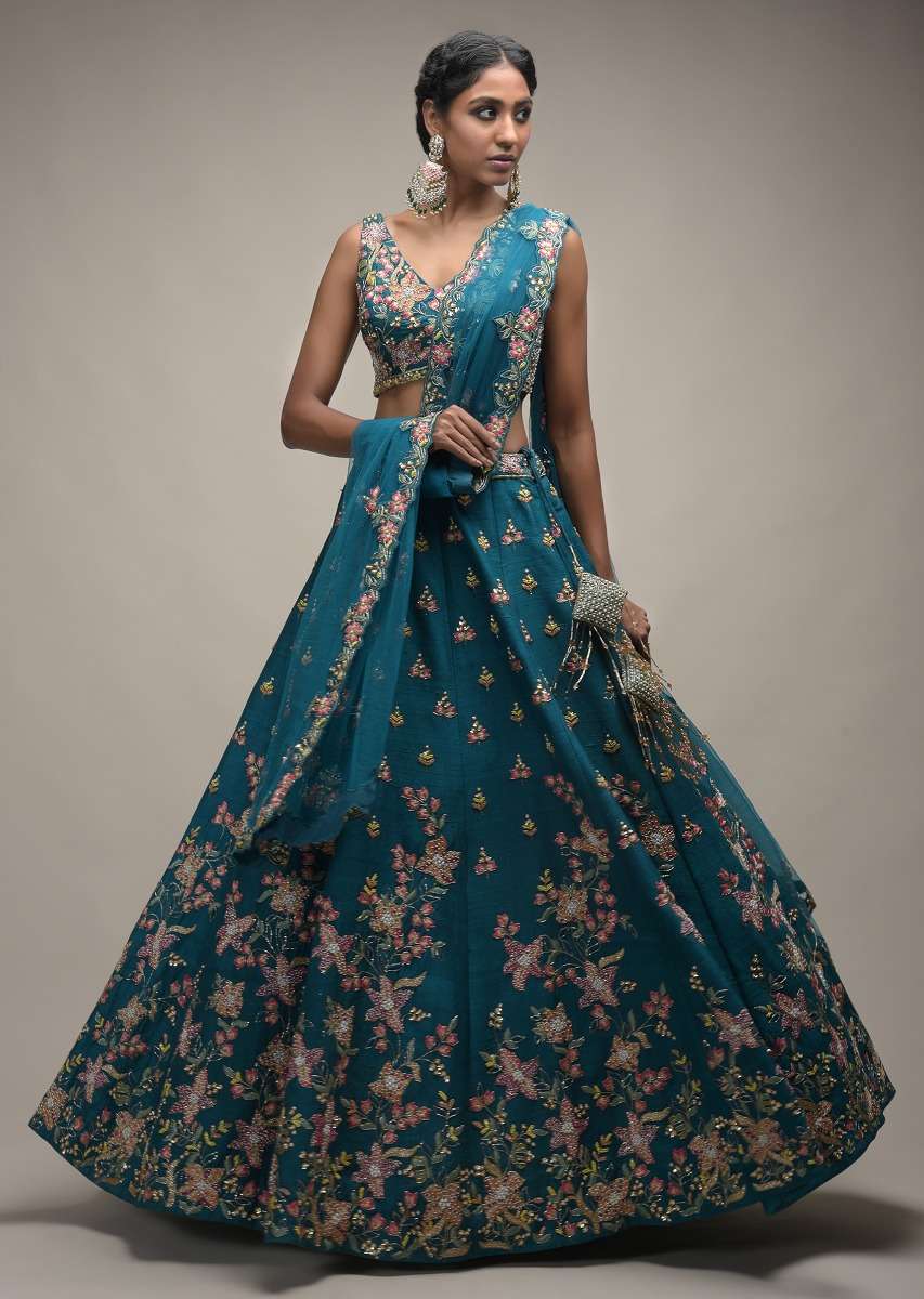 Ocean Green Lehenga Choli In Raw Silk With Colorful Resham Embroidered Spring Blossoms